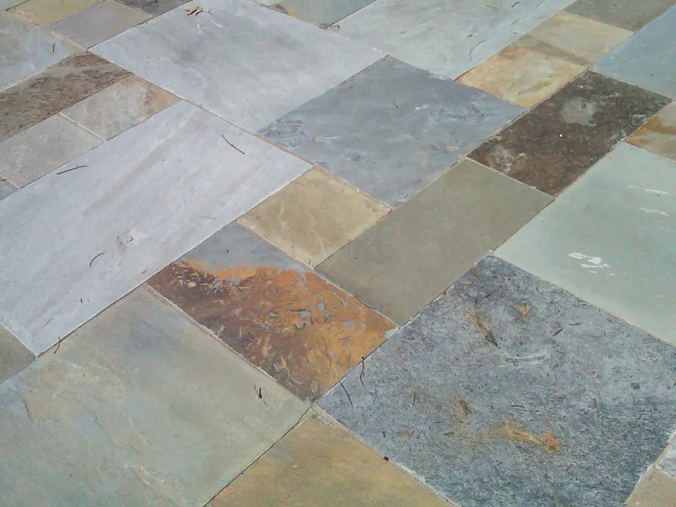 Close detail of full-range bluestone patio slabs with blue, gray, tan, and rust color variation