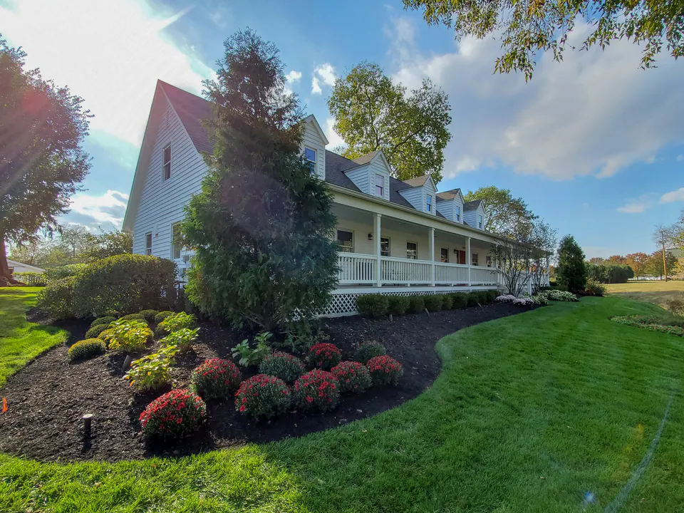 Side lawn and planted foundation edge at the Peabody home office