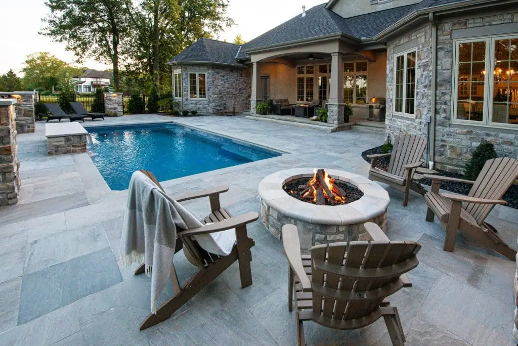 Landscape Design with firepit chairs and swimming pool