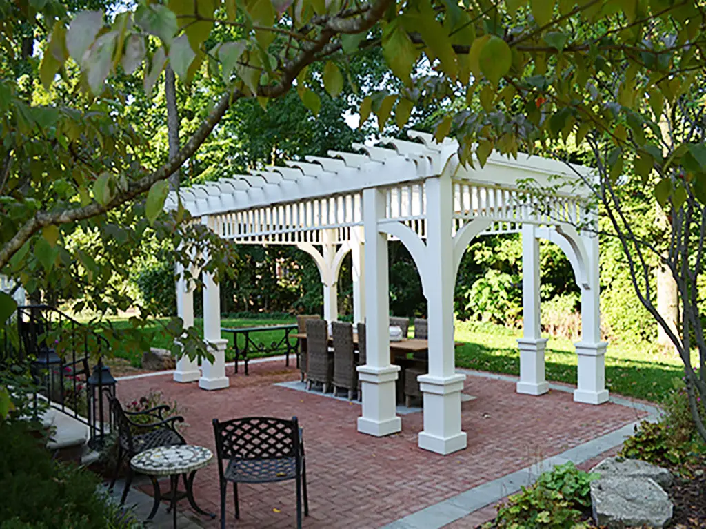 White pergola brick patio